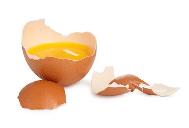 Photo of One cracked chicken egg isolated on white