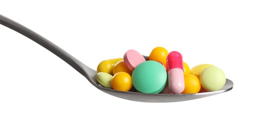 Photo of Spoon with different colorful pills on white background
