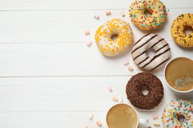 Photo of Flat lay composition with yummy donuts on white wooden background, space for text