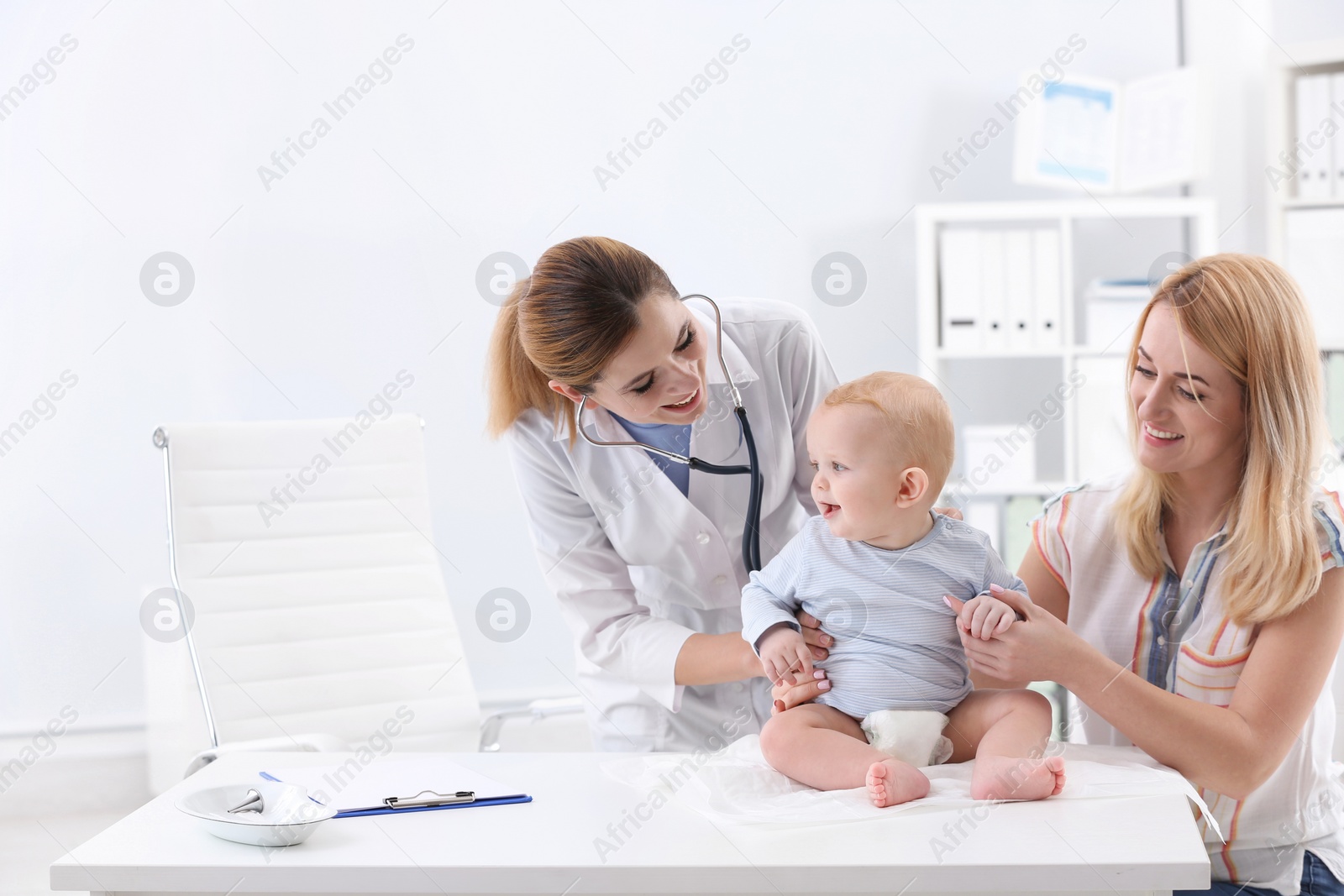 Photo of Woman with her baby visiting children's doctor in hospital