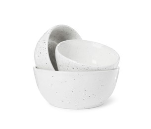 Beautiful empty ceramic bowls on white background