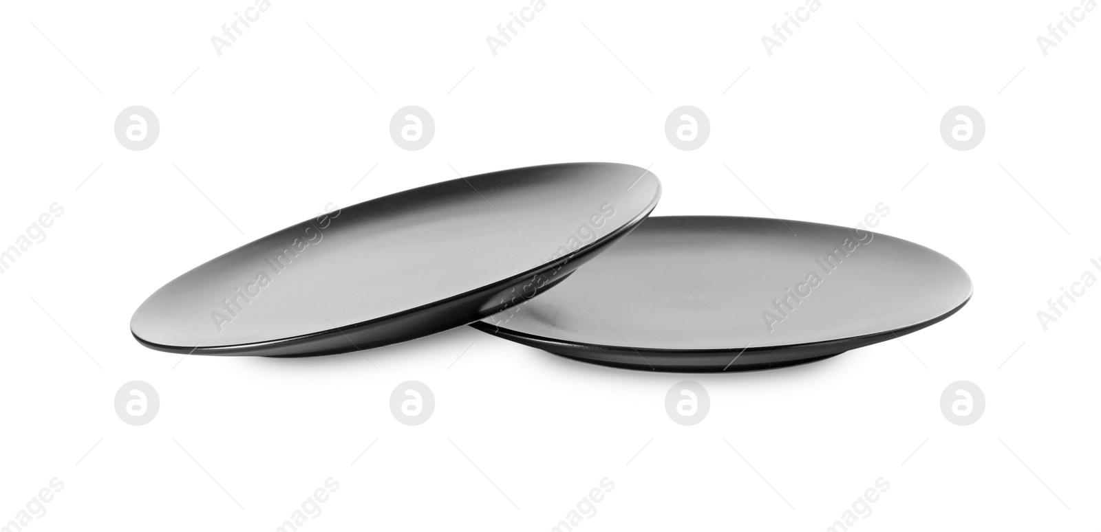Photo of Two clean ceramic plates on white background
