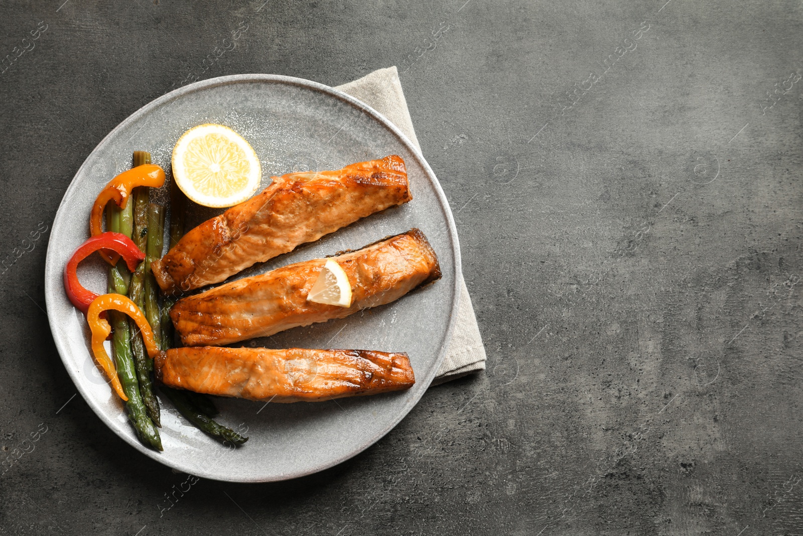 Photo of Tasty cooked salmon served for dinner, top view