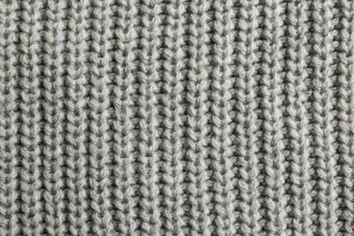 Photo of Beautiful grey knitted fabric as background, top view