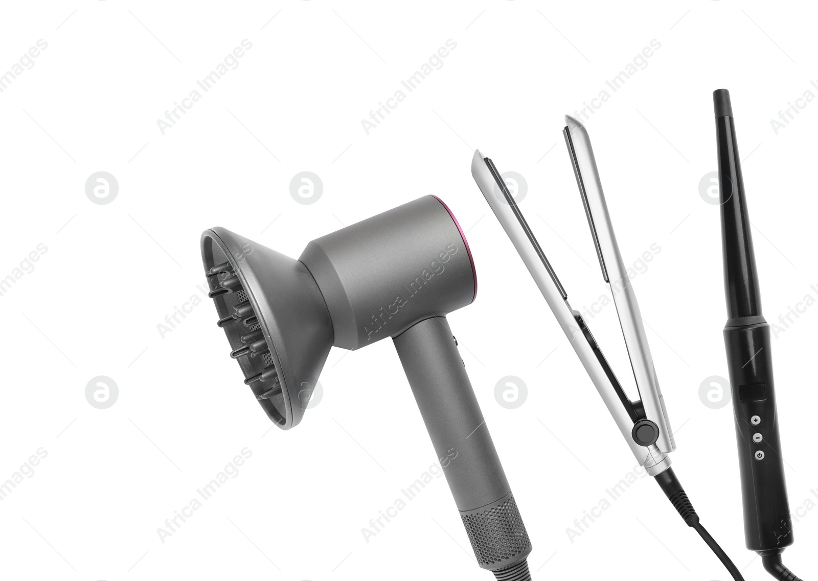 Image of Hair dryer, straightener and curling iron on white background