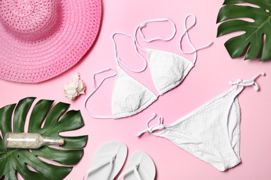 Flat lay composition with stylish bikini on color background