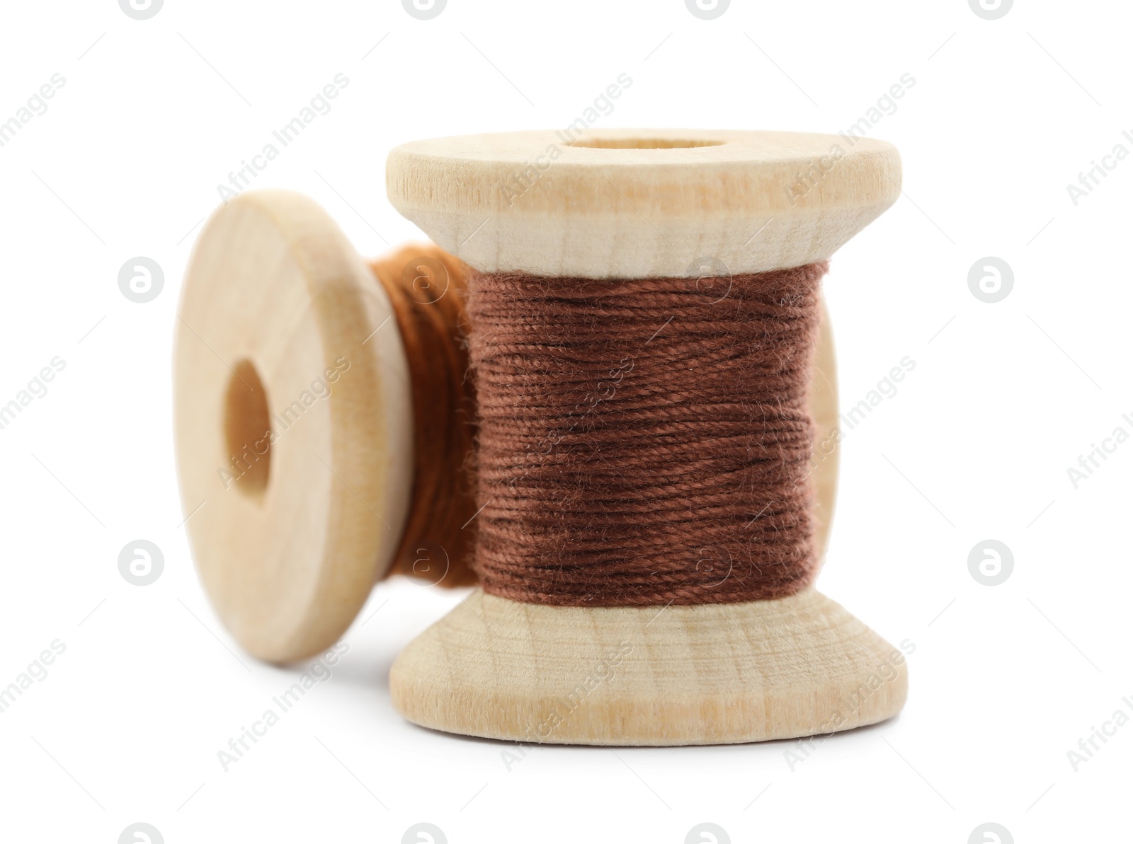 Photo of Different colorful sewing threads on white background, closeup
