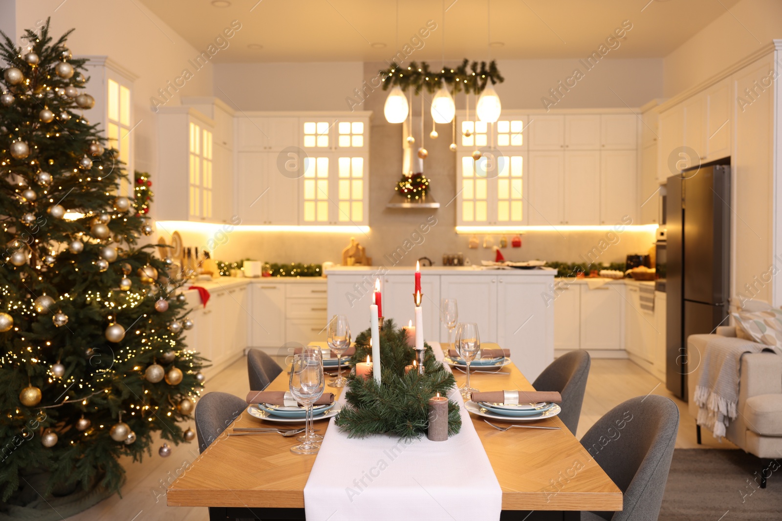 Photo of Cozy spacious kitchen decorated for Christmas. Interior design