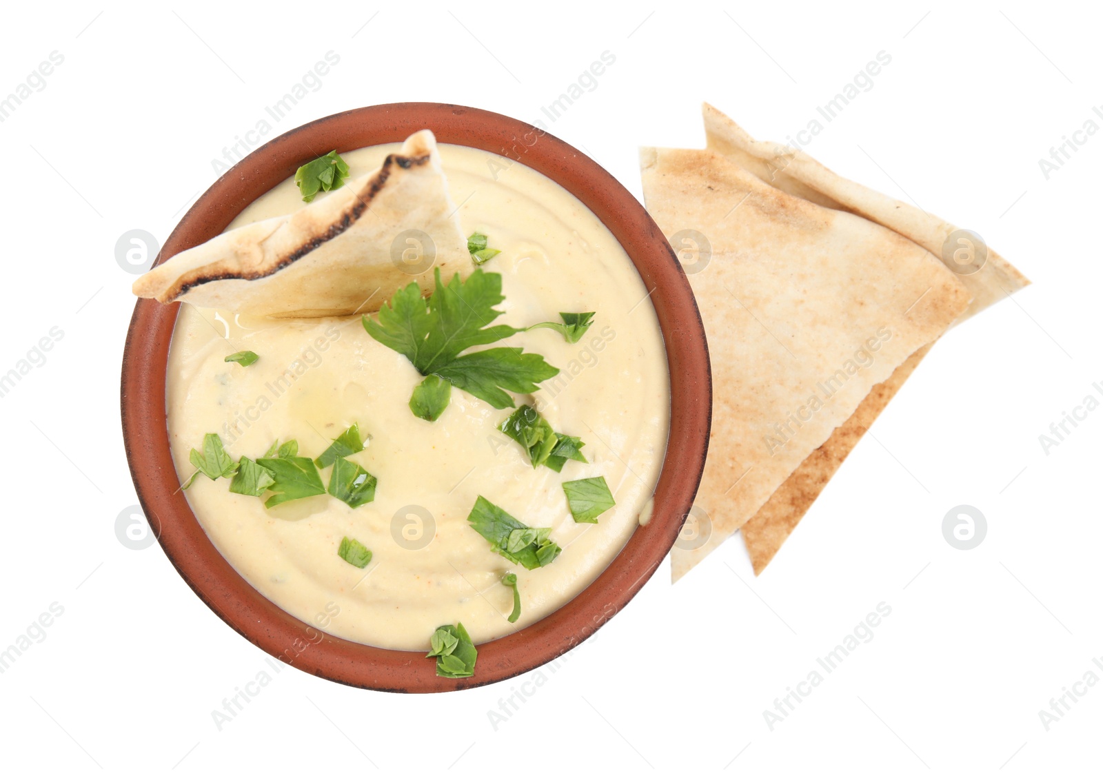 Photo of Delicious hummus with pita chips and parsley on white background, top view