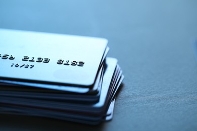 Photo of Many credit cards on table, closeup. Space for text