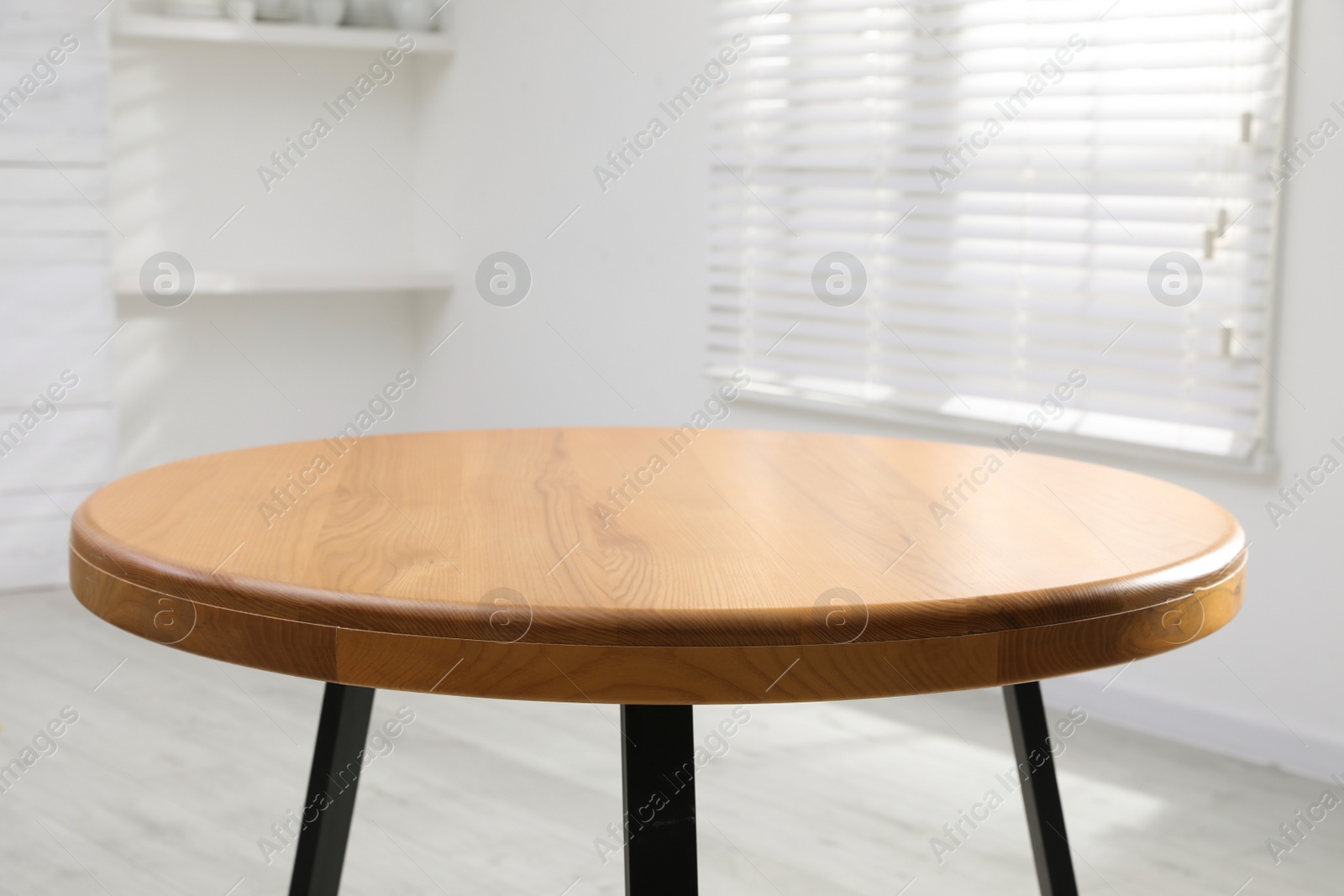 Photo of Empty wooden table indoors, closeup. Stylish furniture