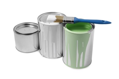 Photo of Cans of paints and brush isolated on white