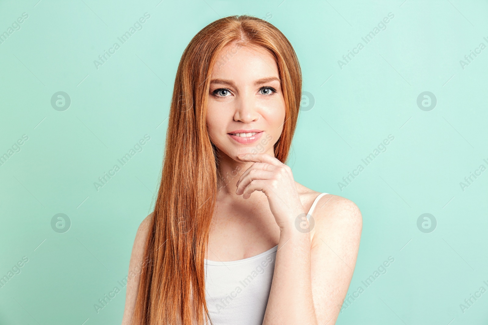 Photo of Portrait of young model with beautiful  hair on color background