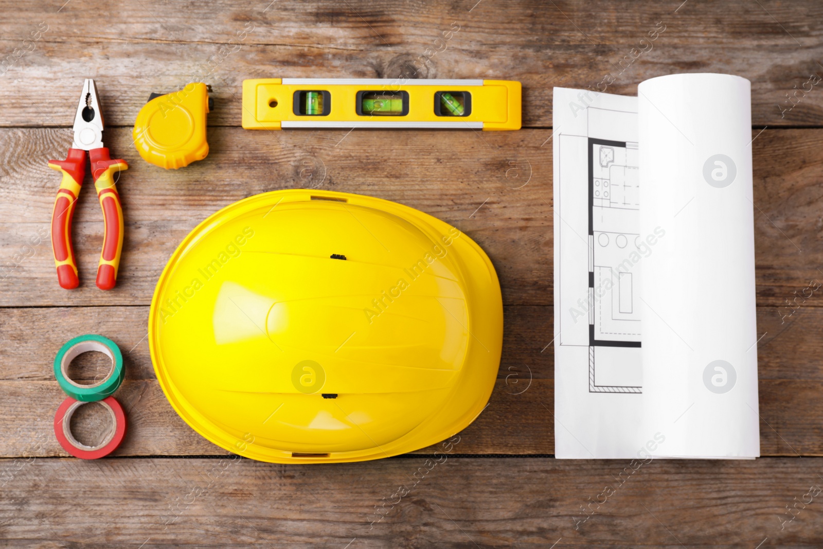 Photo of Flat lay composition with construction tools on wooden background