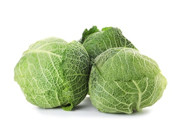 Photo of Fresh green savoy cabbages on white background