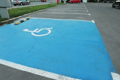 Car parking lot with handicapped symbol outdoors