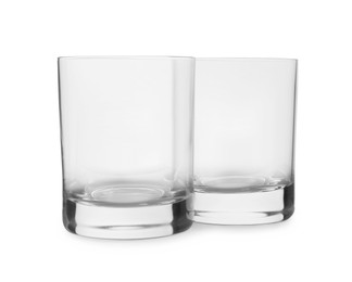 Photo of Elegant clean empty shot glasses isolated on white