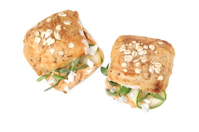 Photo of Delicious sandwiches with hummus, microgreens and cucumber slices isolated on white, top view