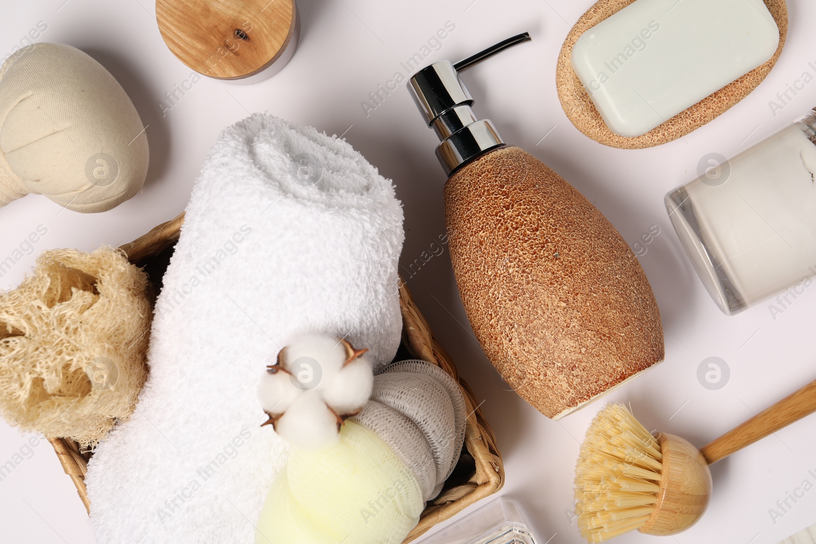 Photo of Bath accessories. Different personal care products and cotton flower on white background, flat lay