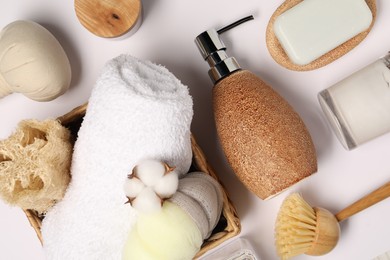 Photo of Bath accessories. Different personal care products and cotton flower on white background, flat lay