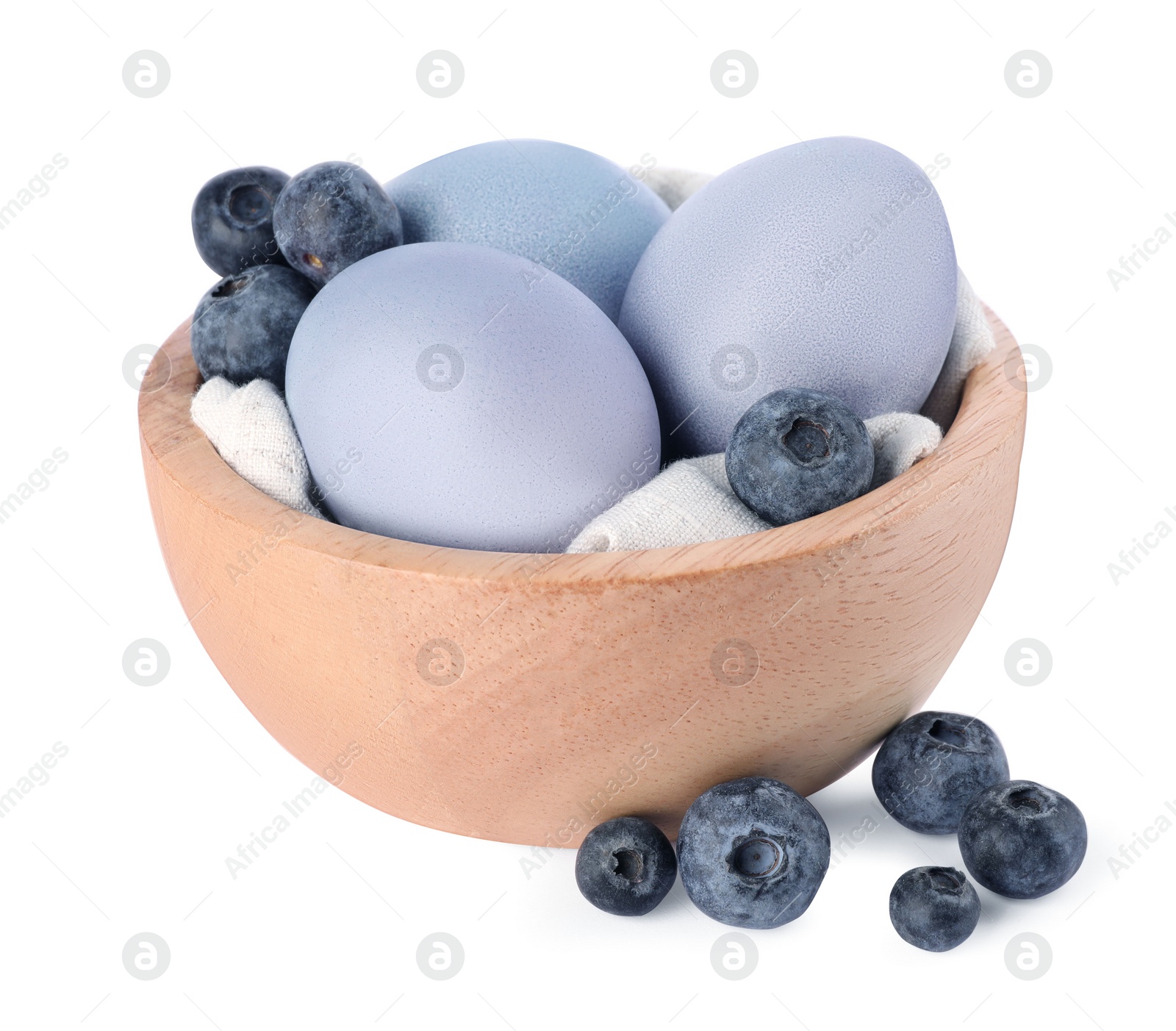 Photo of Colorful Easter eggs painted with natural dye and fresh blueberries on white background