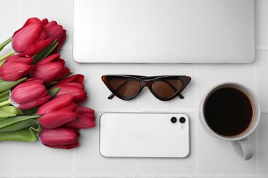 Photo of Flat lay composition with beautiful tulips and laptop on white table