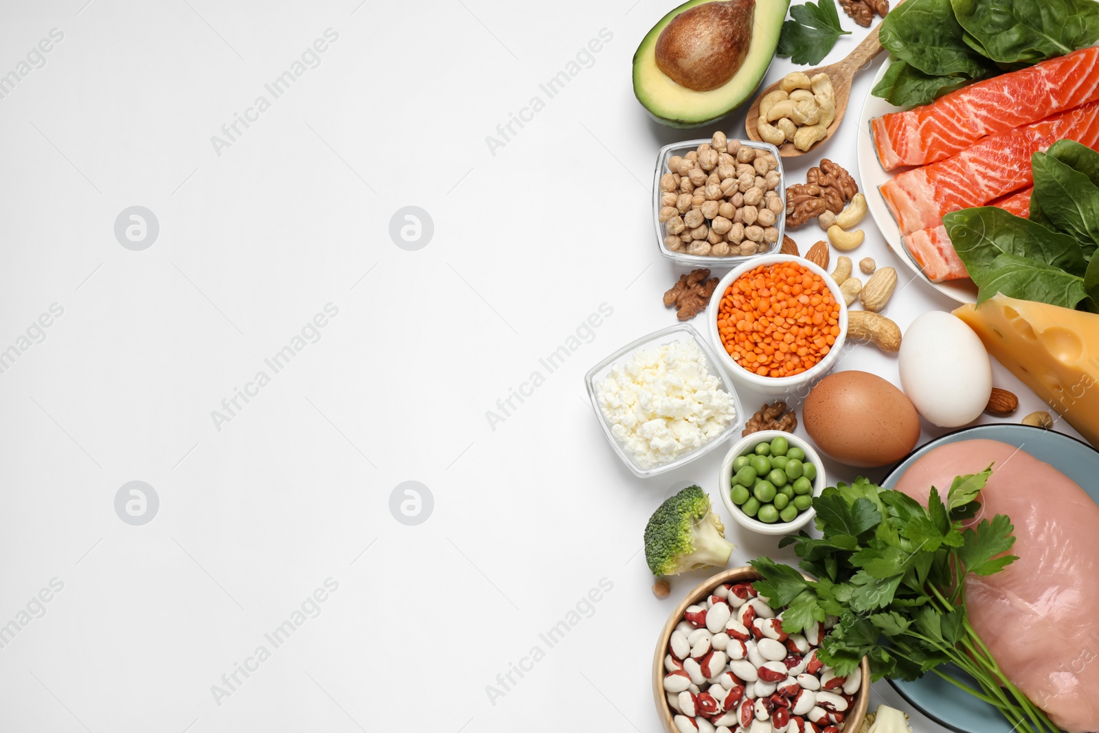 Photo of Different products rich in protein on white background, flat lay