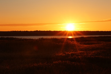 Photo of Picturesque view of beautiful sunrise on riverside. Morning sky