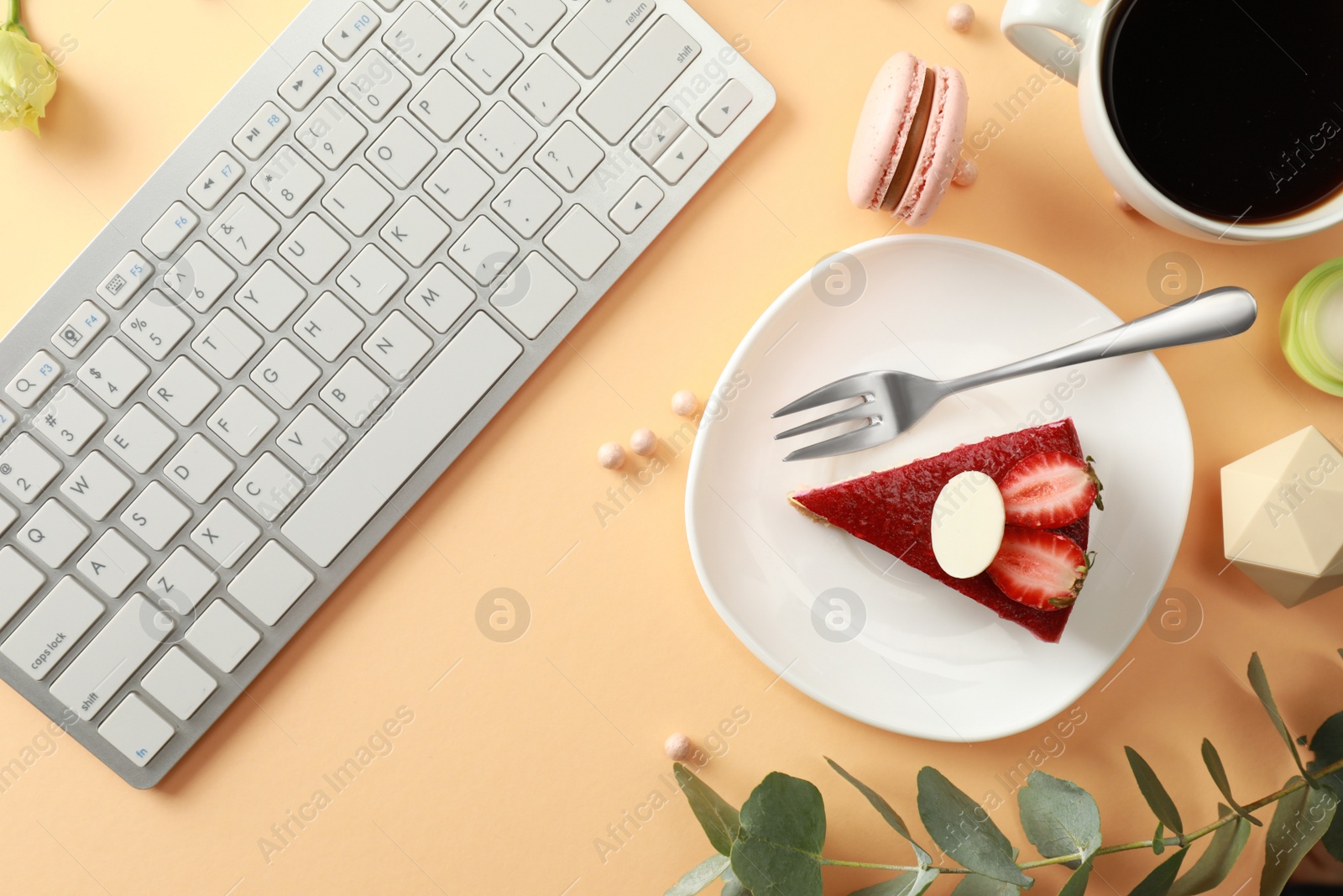 Photo of Flat lay composition with keyboard on beige background. Food blogger's workplace