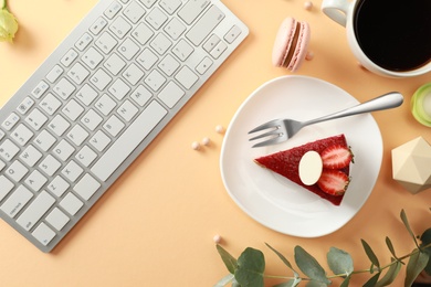 Flat lay composition with keyboard on beige background. Food blogger's workplace