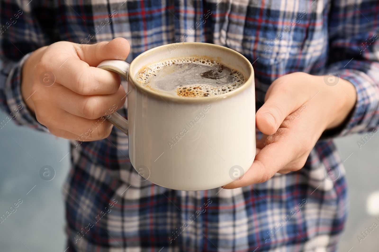 Photo of Man with cup of aromatic hot coffee, closeup