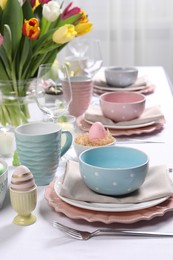 Photo of Festive table setting with beautiful flowers. Easter celebration