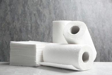 Photo of Rolls of paper towels and napkins on marble table