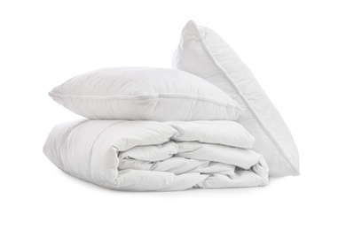 Photo of Soft blanket with pillows on white background