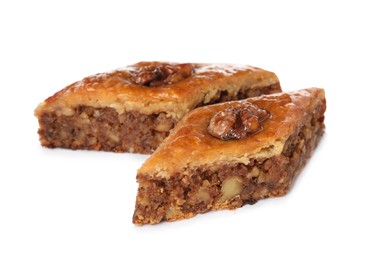 Photo of Delicious honey baklava with walnuts on white background