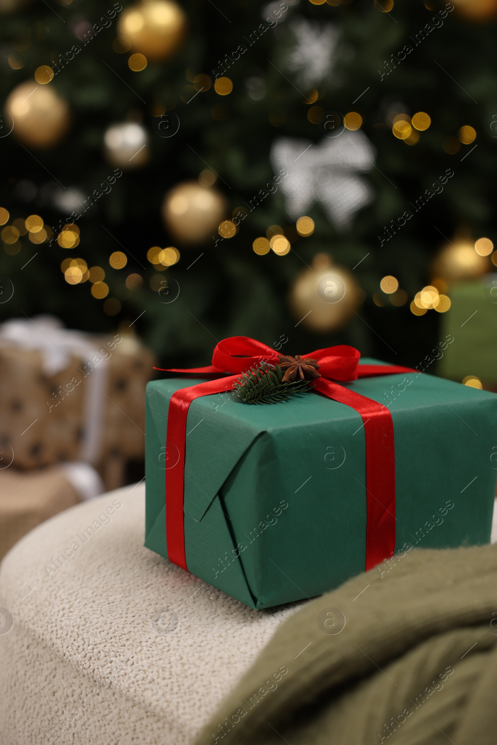 Photo of Gift box in room with Christmas tree