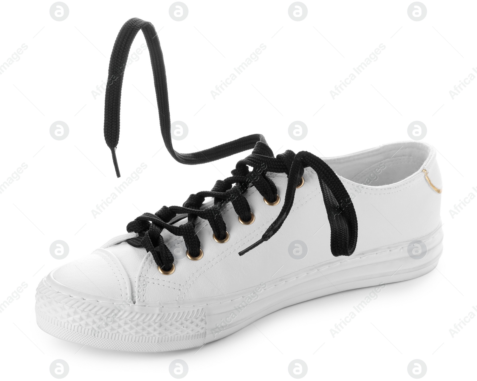 Photo of Stylish sneaker with black shoelaces on white background
