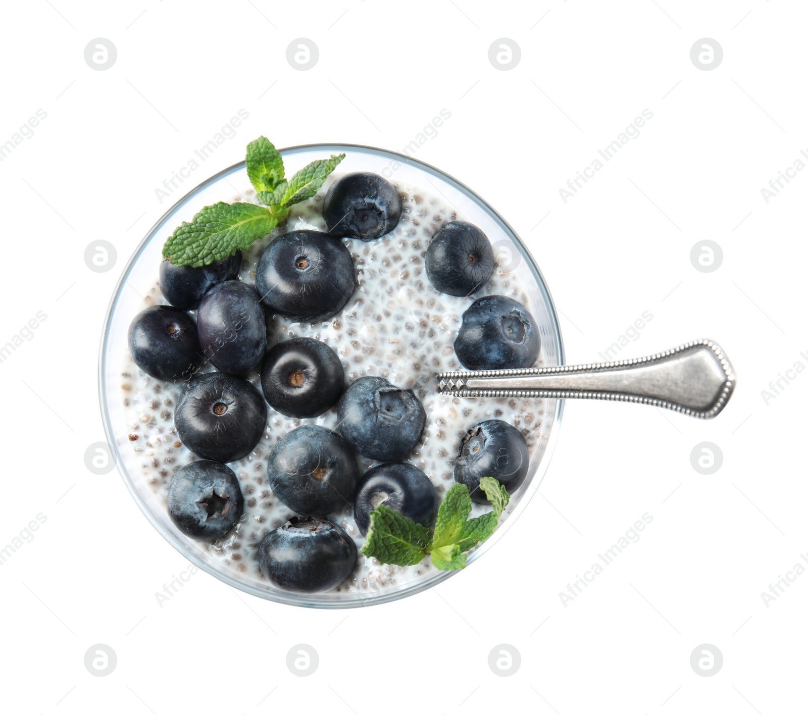 Photo of Tasty chia seed pudding with blueberries in glass on white background, top view