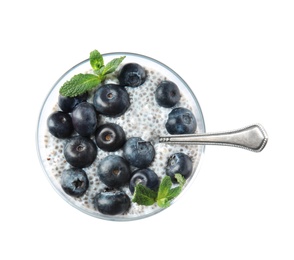 Photo of Tasty chia seed pudding with blueberries in glass on white background, top view