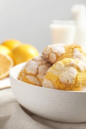 Photo of Delicious lemon cookies in bowl on table, closeup