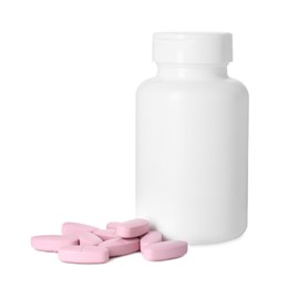 Photo of Bottle and pile of vitamin pills isolated on white