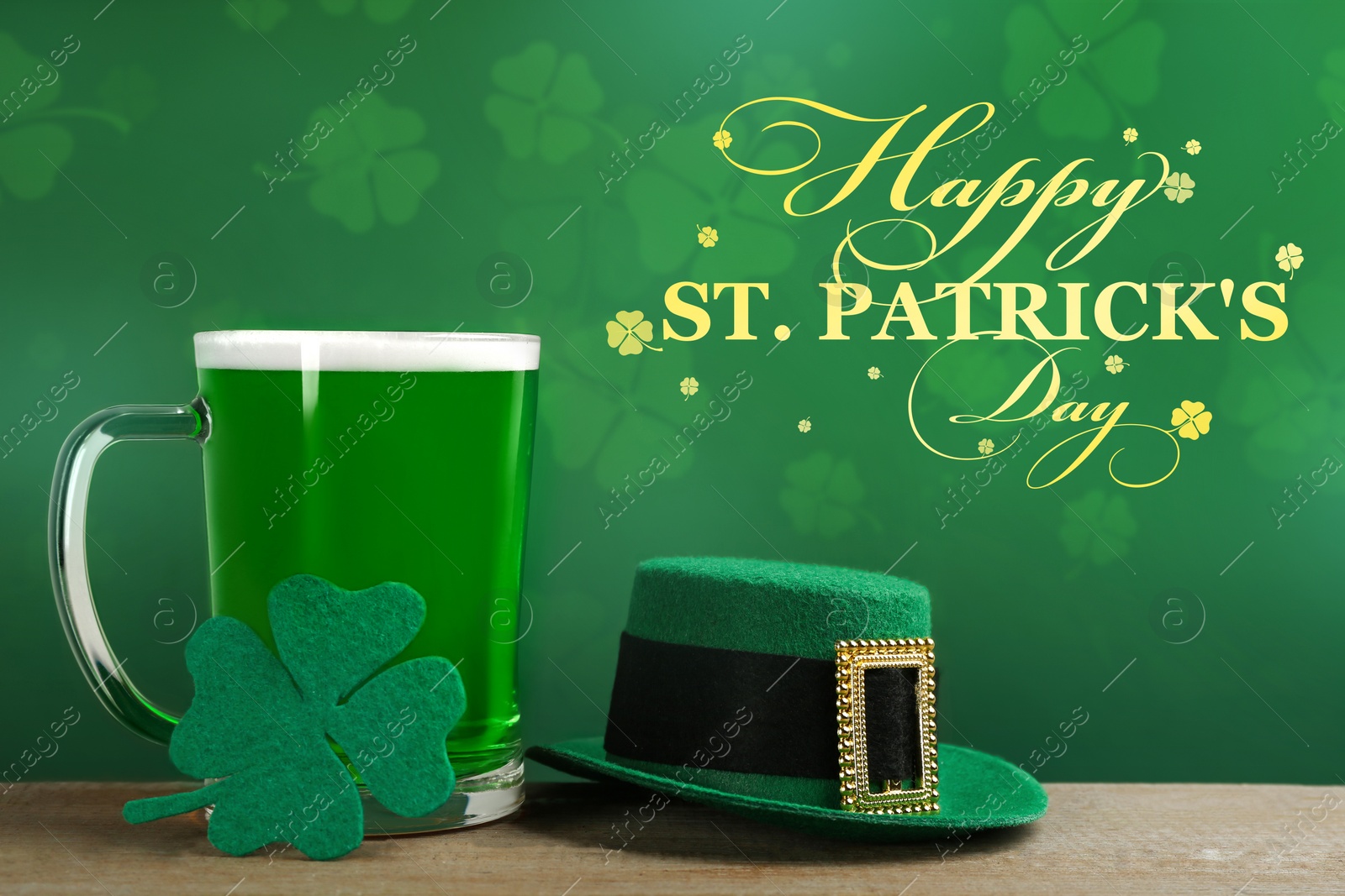 Image of Green beer, hat and clover on wooden table. St. Patrick's Day celebration