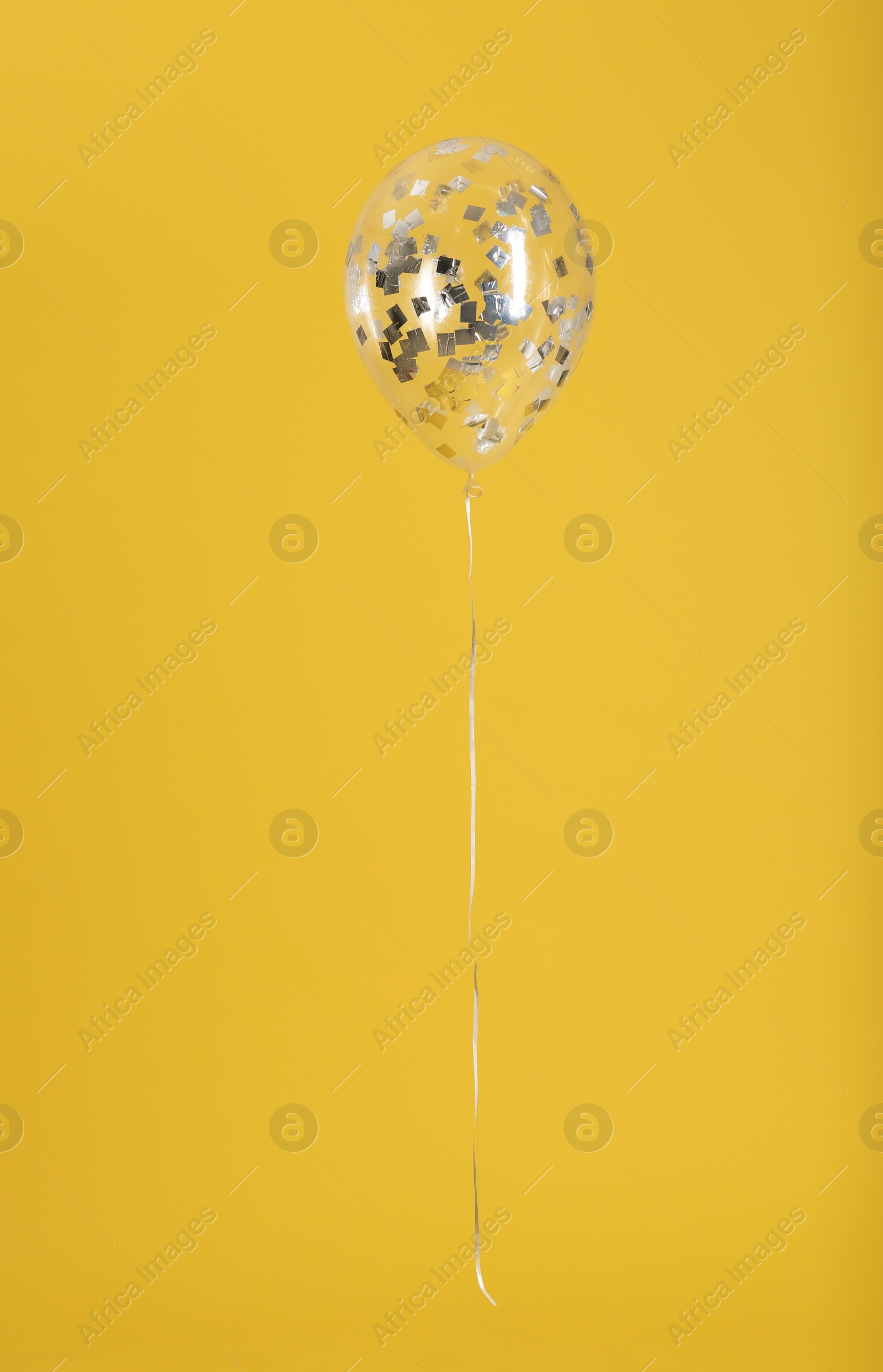 Photo of Balloon with sparkles on color background. Space for text