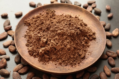 Photo of Composition with cocoa powder and beans on grey background