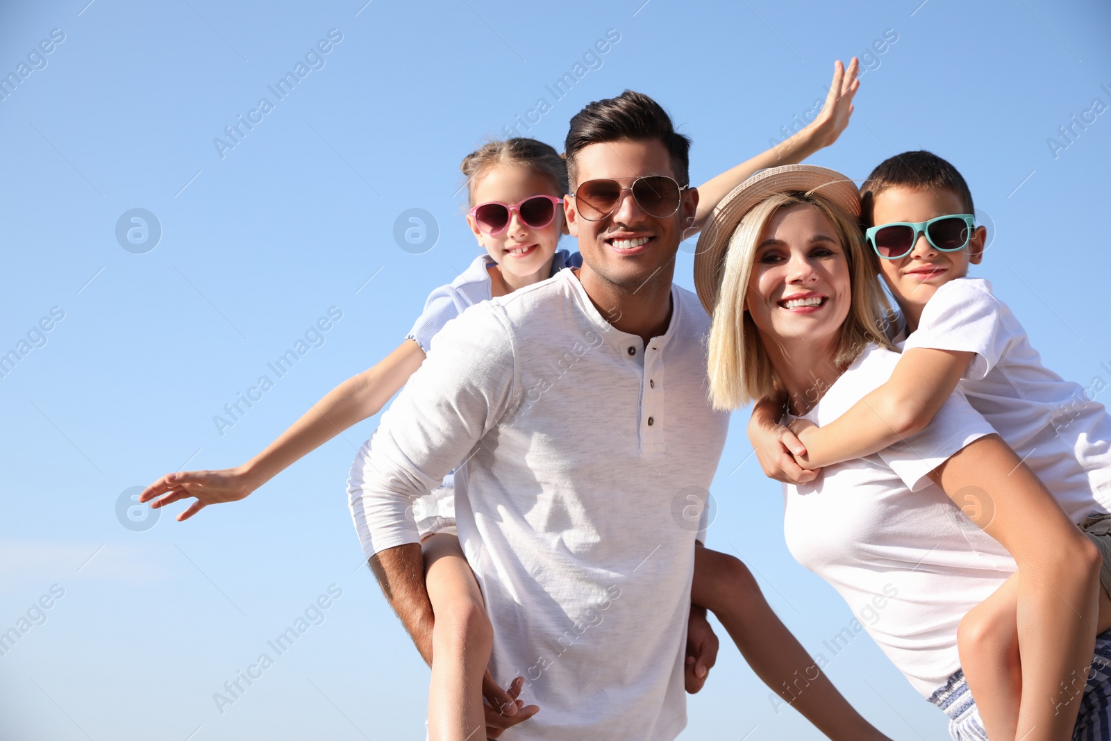 Photo of Happy family outdoors on sunny summer day