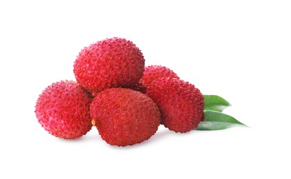 Pile of fresh ripe lychees with green leaves on white background