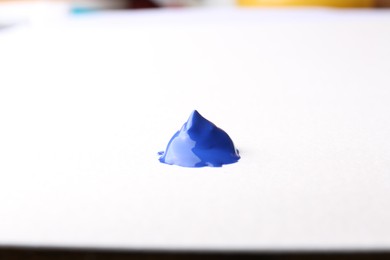 Photo of Sample of blue paint on white background