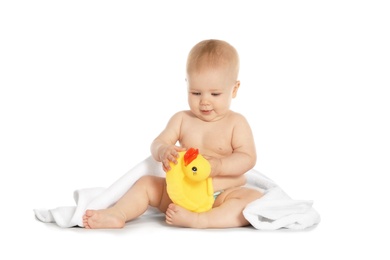 Photo of Cute little baby with soft towel and toy duck on white background