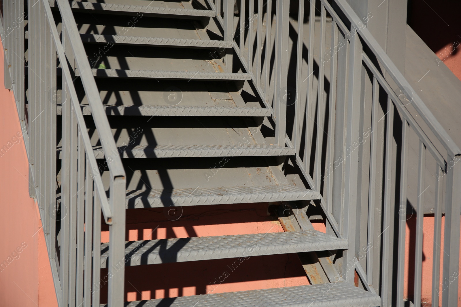 Photo of View of beautiful metal stairs with railings outdoors, closeup