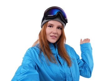 Beautiful woman in ski goggles taking selfie on white background
